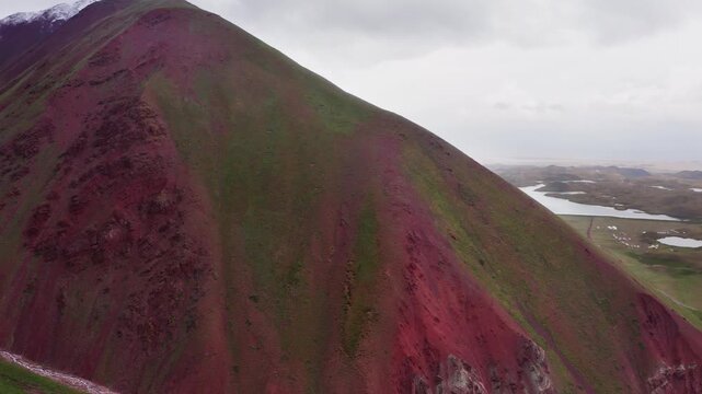 Flying drone 4K video of Tulpar-Kol lake landscape during Pamir mountains trekking. Lenin peak climbing acclimatization route near 3600m Base Camp, Kyrgystan, Central Asia