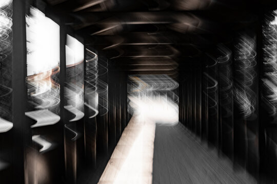 Abstract covered bridge tunnel with S-curve motion blur&mdash;architectural ICM 