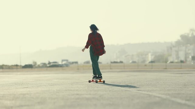 Two alternative young friends longboarding and rollerblading together