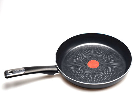 Close up view of Tefal nonstick frying pan with modern design isolated on white background. Sweden. 