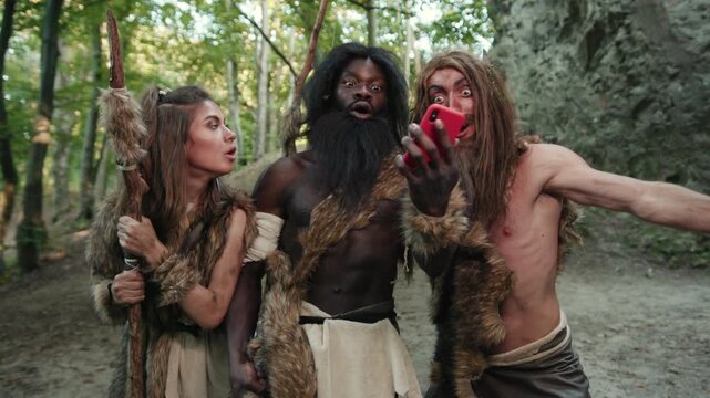 Cavemen Stumble Upon Modern Technology While Surrounded by Their Serene Natural Landscape