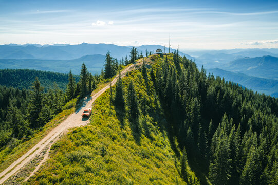 Red pickup truck on ridge road near Burley Mountain Fire Lookout, Washington