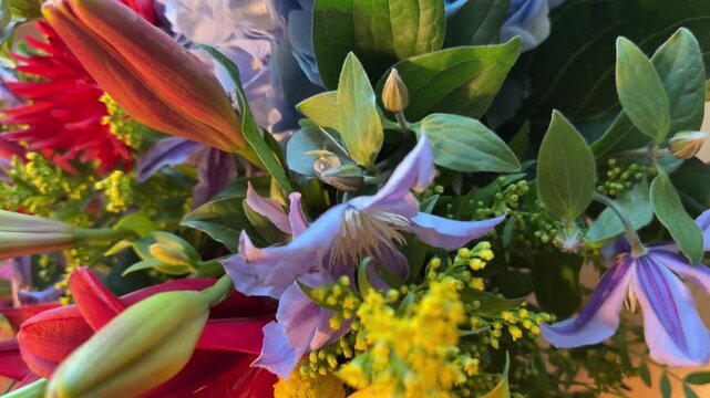 Bright bouquet with blue hydrangea, red dahlia and yellow calla