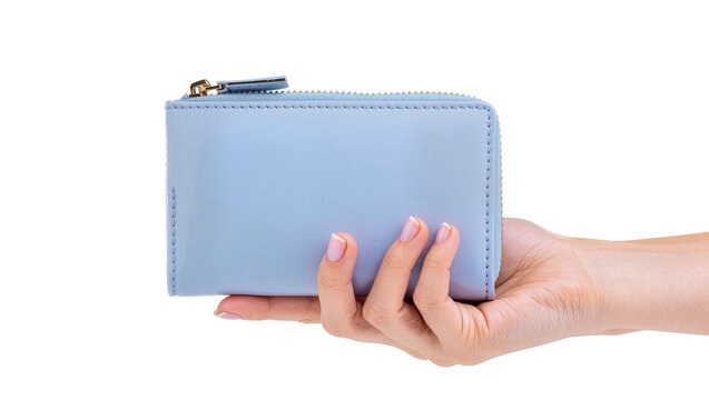 Isolated fashionable light blue small wallet held by a woman's hand, close-up shot
