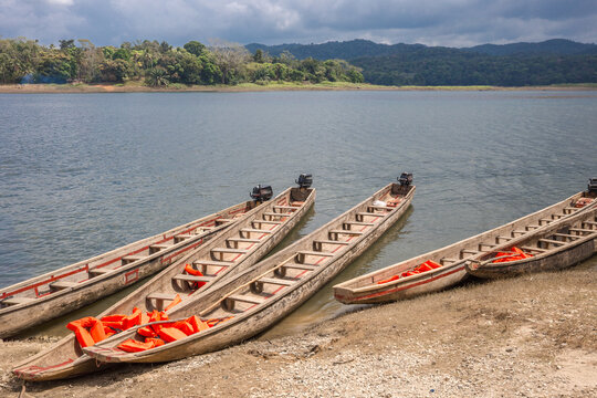 Embera indigenous piragua boats equipped with life jackets on the shores of the Chagres River, Chagres National Park, Panama
