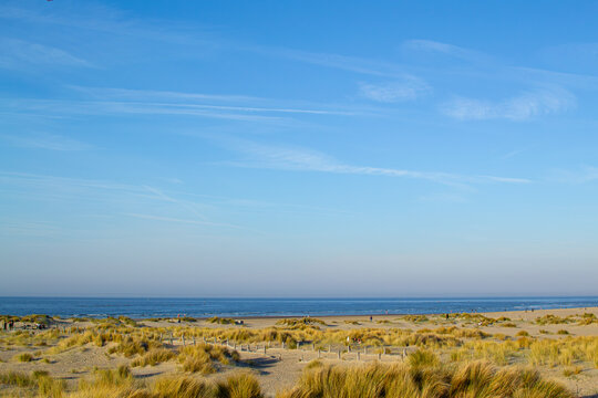 Dunkirk beach, Plage Dunkerque, promenade near the sea, coastline, sand, dunes, Malo-les-Bains, France, La Manche, people walking far away, a large beach known from the Second World War