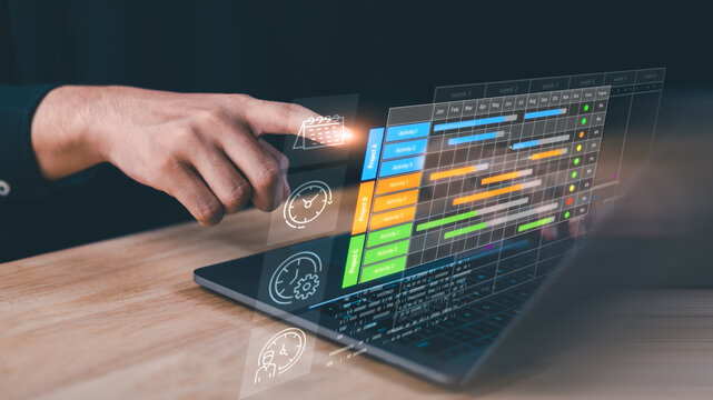 Project coordinator manages task scheduling and progress tracking on digital Gantt chart dashboard, optimizing workflow efficiency, timeline control, resource allocation, team performance monitoring