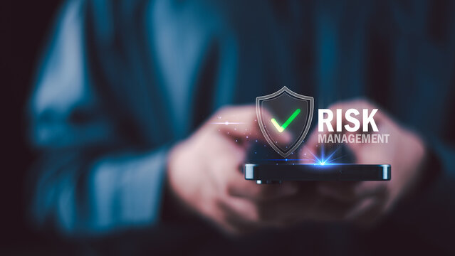 Risk manager ensures secure mobile transaction protection with digital shield verification, fintech risk control strategy, fraud detection system, encrypted payment process, cybersecurity compliance