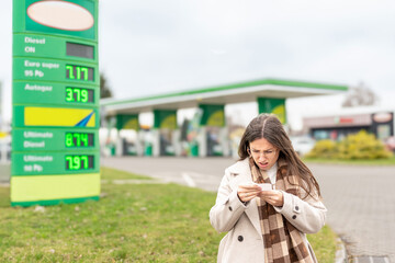 Personal finance pressure woman reviewing fuel purchase © Maksym