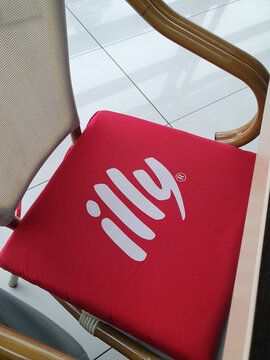 Illy sign on bar chair