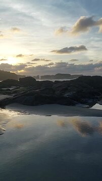 Sunset over the rocky formations of Los Castros Beach in Ribadeo, Spain.