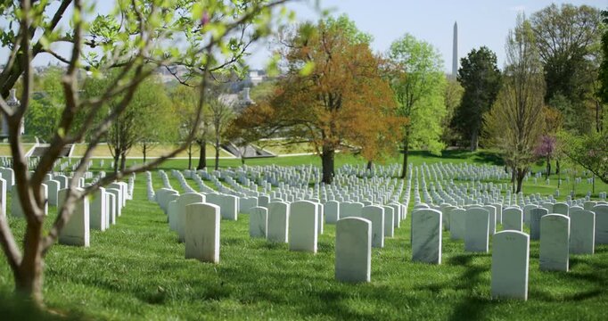 Headstones in Arlington National Cemetery with Washington Monument in Distance