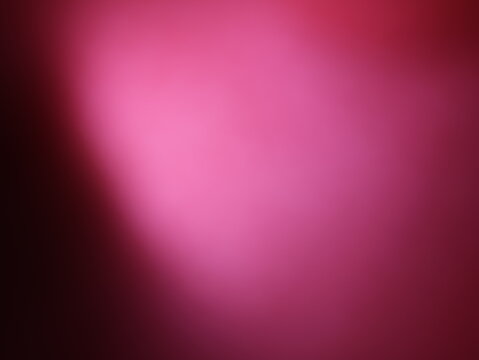 Una toma de cerca de un fondo abstracto de  color rosado con un degradado ligero desenfocado