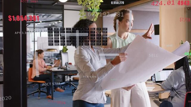 Team at glass partition left holding plan pointing for planning while finance overlay showing SELL