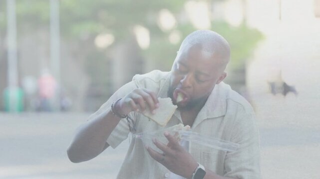 Man opening takeout lid eating sandwich responding animated overlays on food utensil gestures