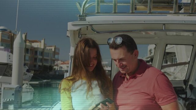 Daughter extending smartphone, taking selfie with father on boat, tech overlay scanning, sharing
