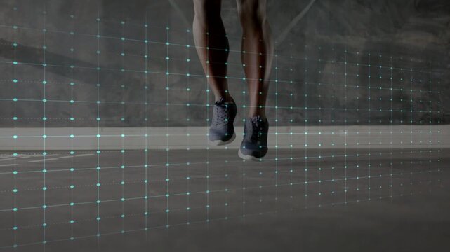 Fitness athlete doing rhythmic jumps on concrete, takeoffs initiating ECG line syncing with shoes