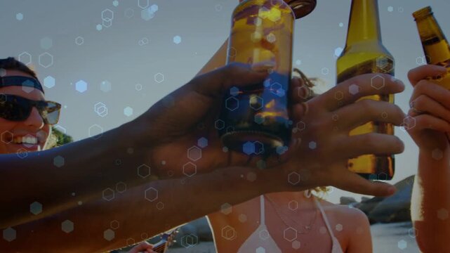 Friends raising bottles for sunset travel toast on beach, clinking above cam, hex bokeh glinting