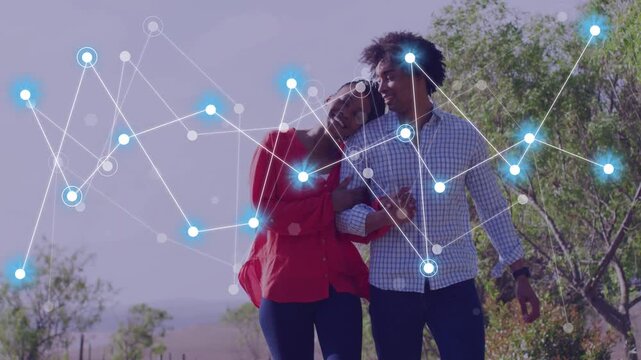 Couple walking linked arms along rural path, nodes fading left, overlapping them, showing tech link