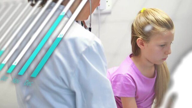 Medical provider reaching, placing hand on child's arm in clinic with charts fading, preparing exam