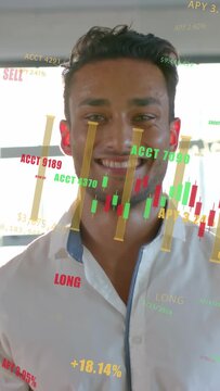 Vertical video: Man reacting to rising finance gains and shifting to broad smile as charts floating
