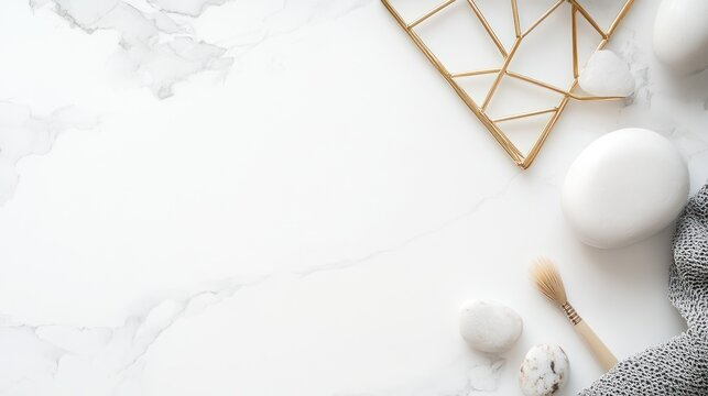 Marble background with golden decor, objects & brush, grey towel, two stones and soap