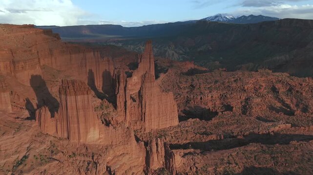 Fisher Towers Moab Utah Aerial Drone Orbit Shot La Sal Mountains Snow Peaks 4K