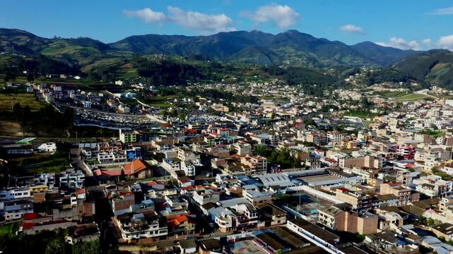 Otavalo, Ecuador: 5-1-2023: aerial view over the city Otavalo surrounded by mountains
