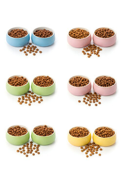 Six bowls of dog food with spilled kibbles on a light background