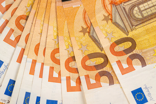 Detailed euro banknotes representing investment and capital, overlapping fifty notes emphasize asset accumulation, market intent, and financial growth potential