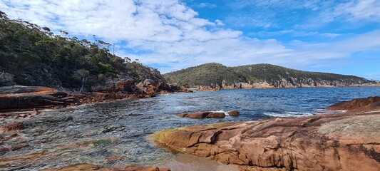 Large boulders and rocks on the shore of the sea © HDC Creative