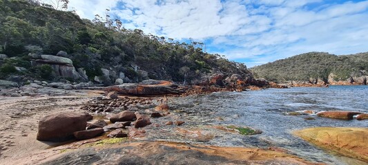 Large boulders and rocks on the shore of the sea © HDC Creative