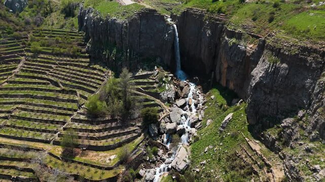 Top angle drone shot showing a waterfall in Faraya Lebanon flowing down between rocks