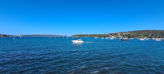 Boats on a summers day going into harbor © HDC Creative
