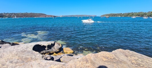 Boats on a summers day going into harbor © HDC Creative