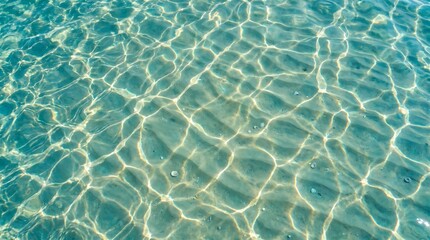 Fototapeta premium Turquoise ocean surface with sunlight ripples and aquatic vibe
