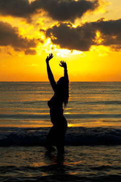 Woman with silhouette and sunrise morning