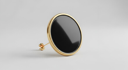 Fototapeta premium Gold earring with black stone on white background