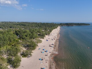 Aerial view of sandy beach and turquoise water at Sandbanks Provincial Park, Ontario, Canada on summer day. g.