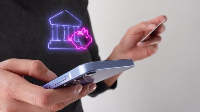 Bank savings and financial management. Businesswoman holding a bank card while holding a smartphone with a virtual bank icon and a piggy bank.