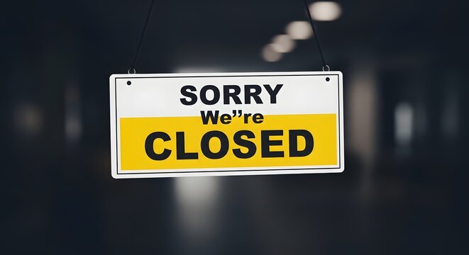 Sorry we're closed sign on dark background