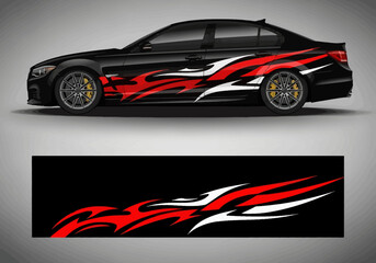 Obraz premium Black sedan with red and white racing livery vinyl wrap