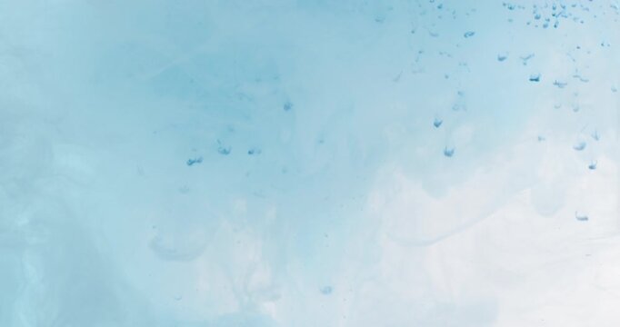 Water droplets scatter across a soft blue background creating a fresh and minimal abstract texture.