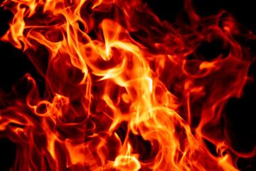 Fototapeta premium Fire flames on black. Fire sparks. Fire background. Fire glowing effect.