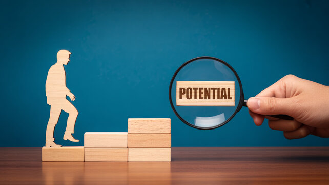 A wooden figure climbs block steps symbolizing career progression while a magnifying glass highlights the word potential