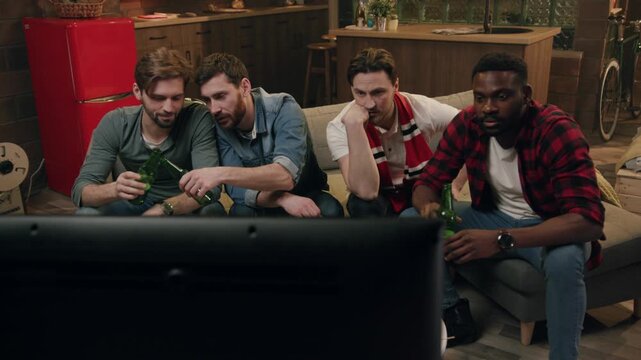 Friends enjoy a thrilling sports game in a cozy living room, bonding and creating memories