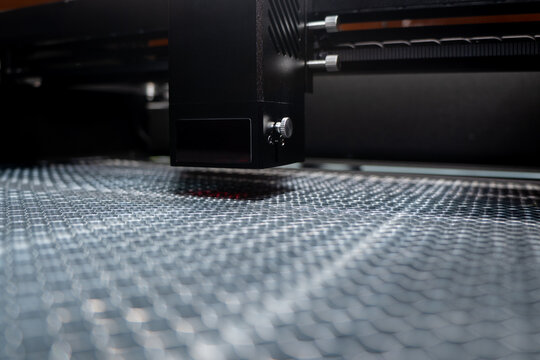 Industrial laser engraving machine. Laser cut. Diode Laser cutting beam. Cnc laser head.