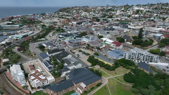 Tilt up aerial view of Mossel Bay city center with Bartolomeu Dias Museum Complex in the foreground. South Africa.