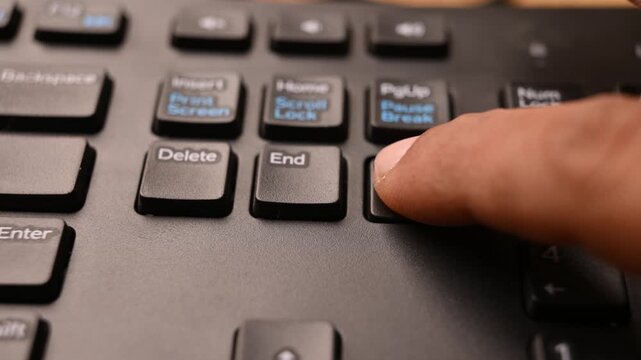 Pressing Page Down Key on Keyboard to Scroll Down Document on Computer
