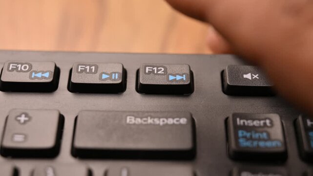 Pressing F12 Key on Keyboard to Open Developer Tools on Computer